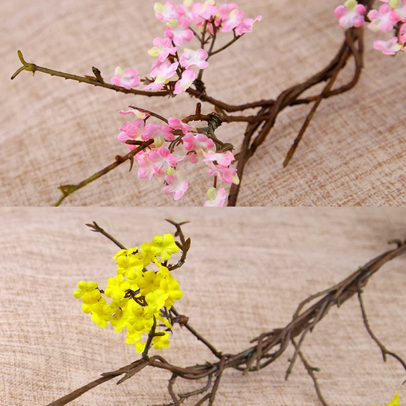 Close-up of pink yellow detail for artificial small blossom branch