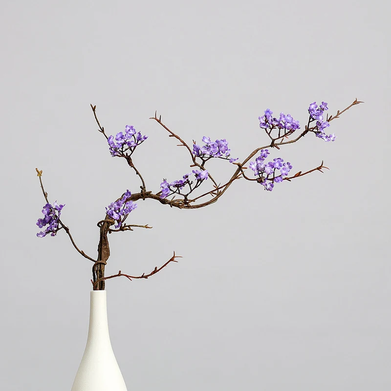 Purple artificial small blossom branch