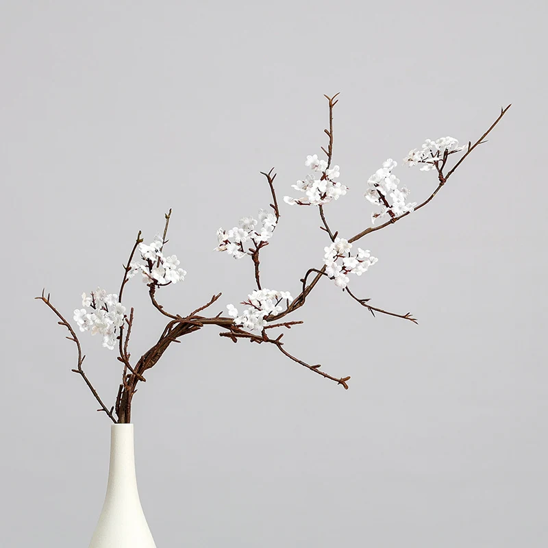 White artificial small blossom branch