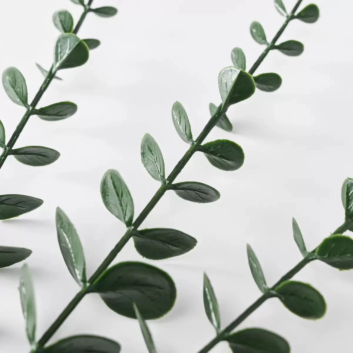 Close-up of leaves on artificial small-leaf greenery stem