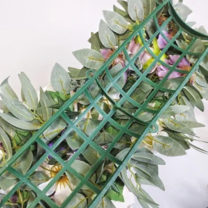 Close-up of artificial sunflower rose floral centerpiece swag