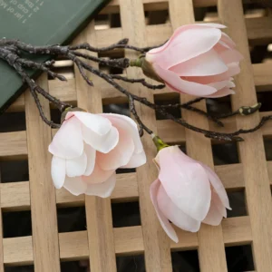 Close-up of pink artificial three-head magnolia branch