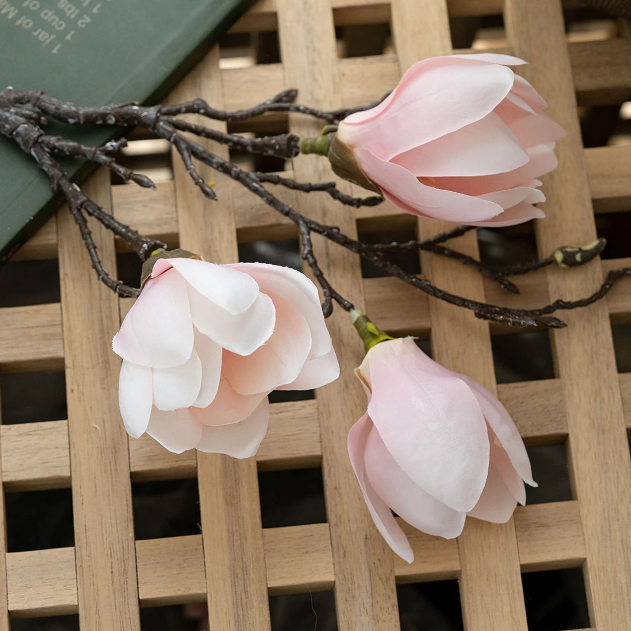 Close-up of pink artificial three-head magnolia branch