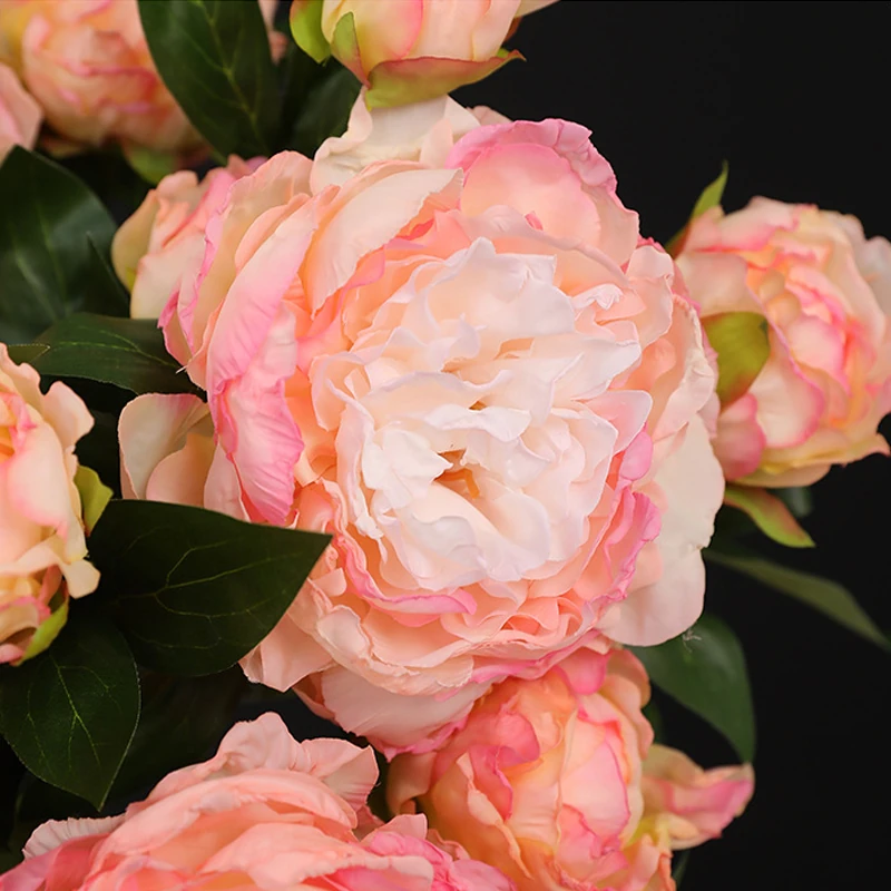 Close-up of pink artificial three-head peony spray