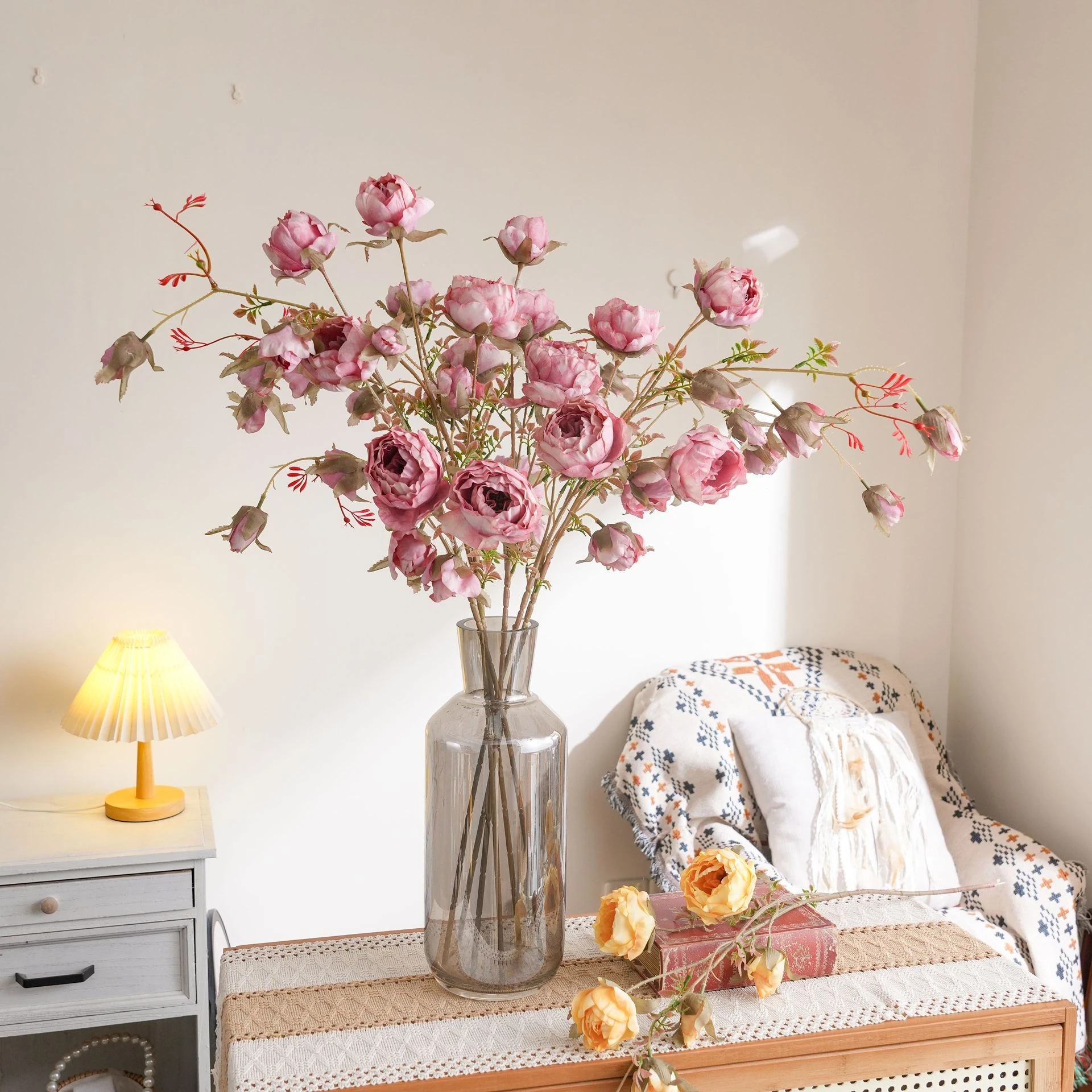 Application display of pink artificial wild rose spray