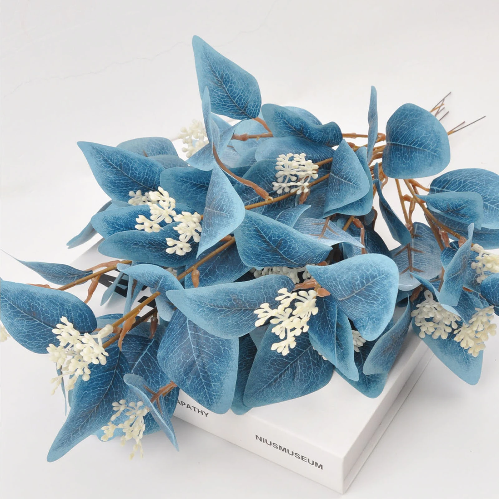 Close-up of blue colored artificial eucalyptus spray