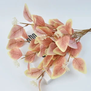 Close-up of blush colored artificial eucalyptus spray