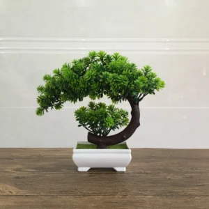 Green potted artificial conifer bonsai tree