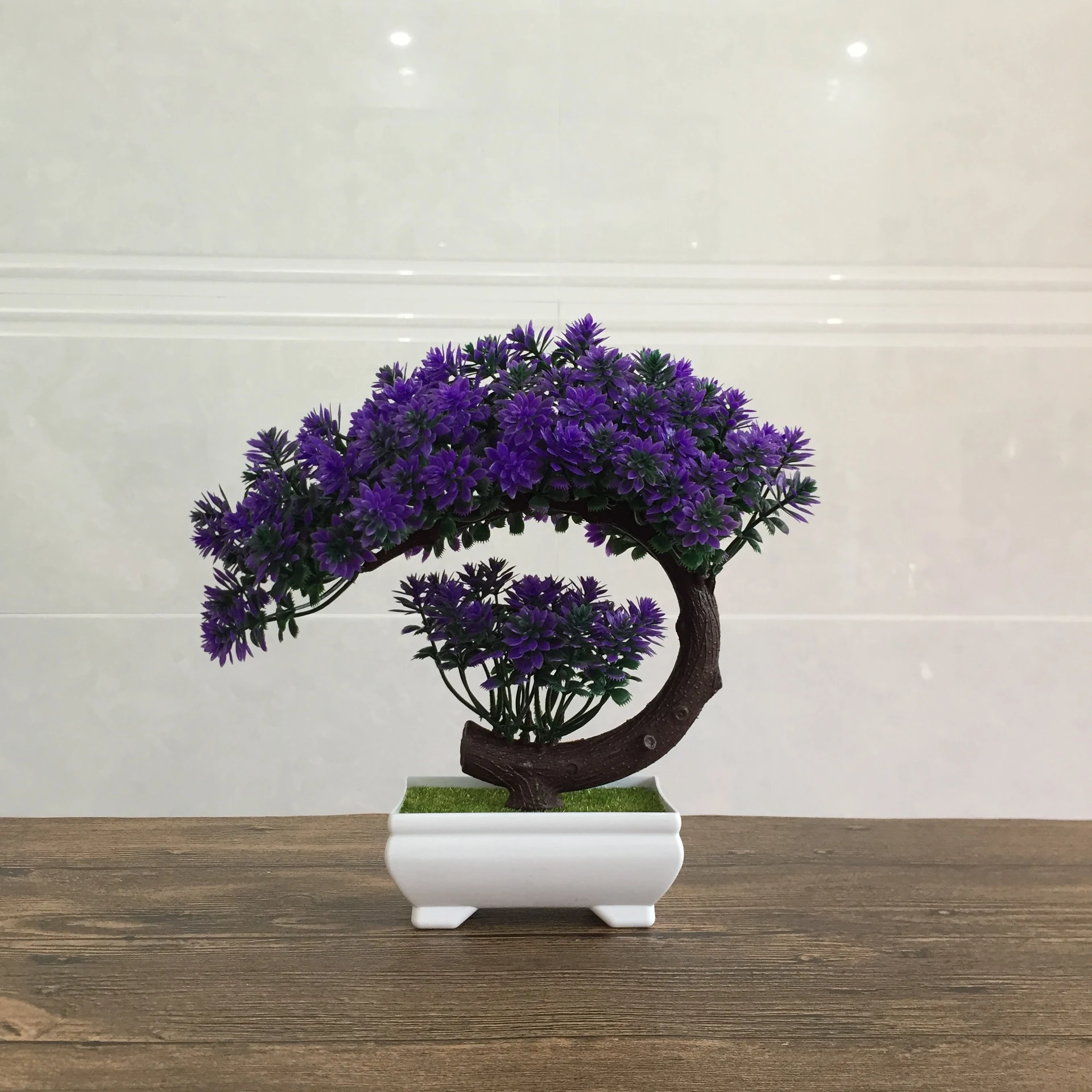 Purple potted artificial conifer bonsai tree