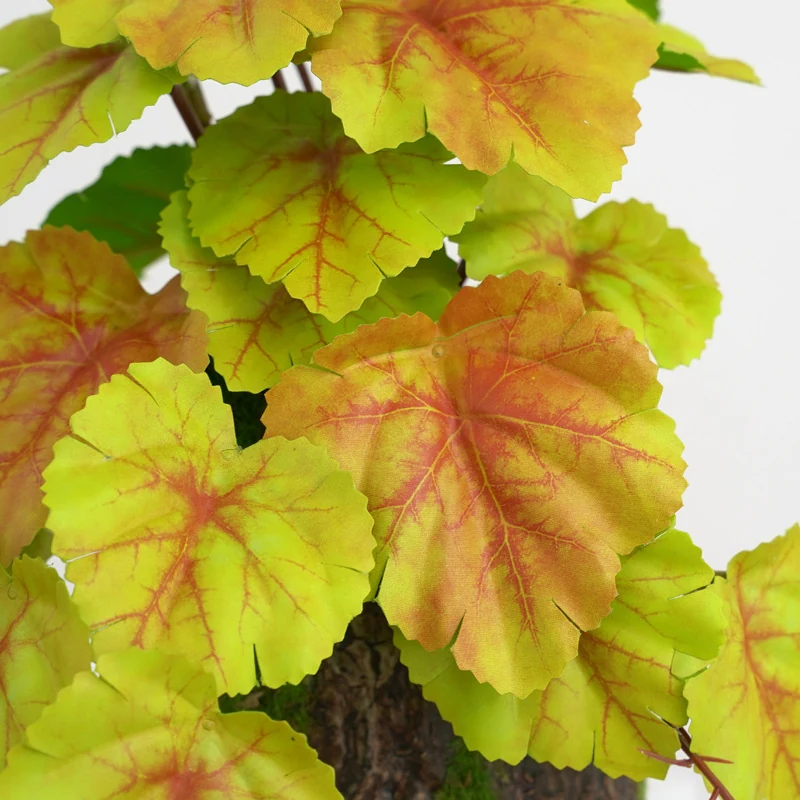 Close-up of autumn yellow detail for potted artificial coral bells plant