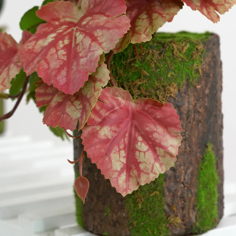 Close-up of crimson detail for potted artificial coral bells plant