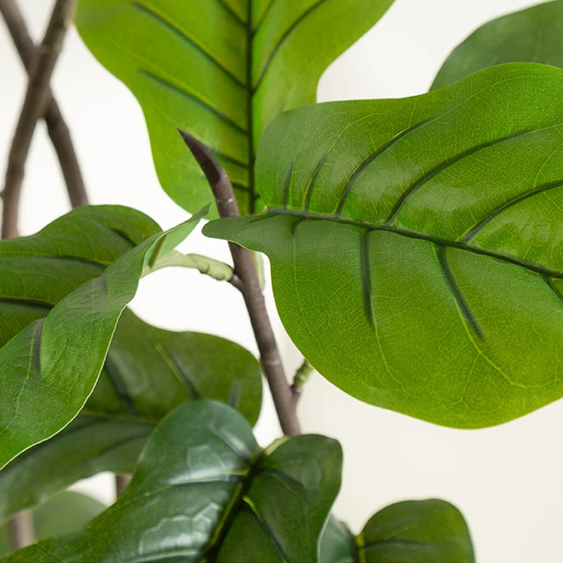 Close-up of potted artificial fiddle leaf fig tree collection