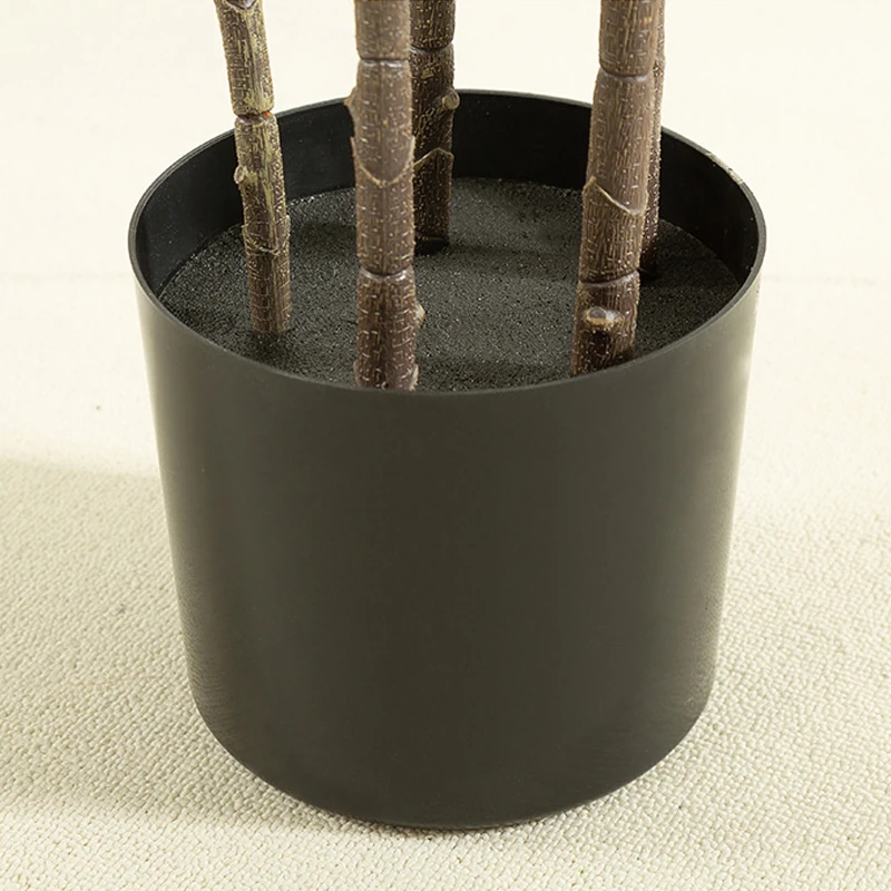 Close-up of potted artificial fiddle leaf fig tree collection