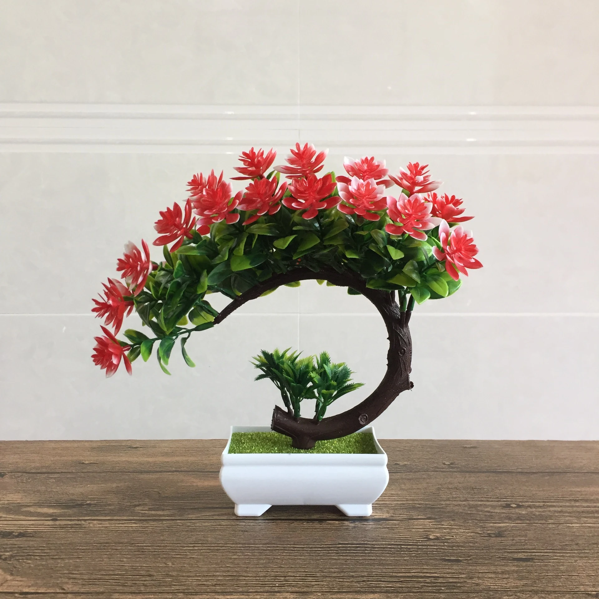 Red potted artificial flowering bonsai tree