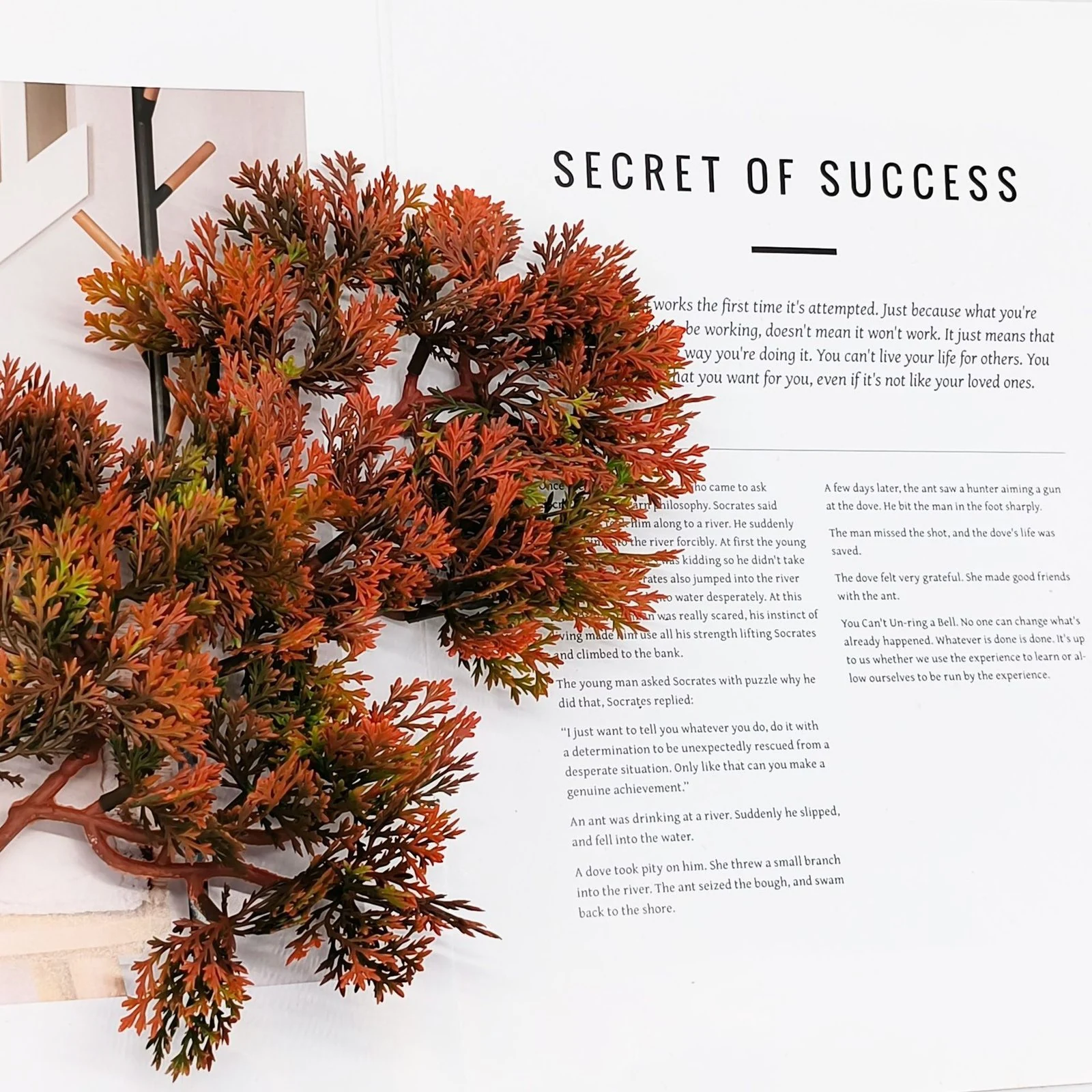 Close-up of rust-orange and olive-green artificial juniper foliage