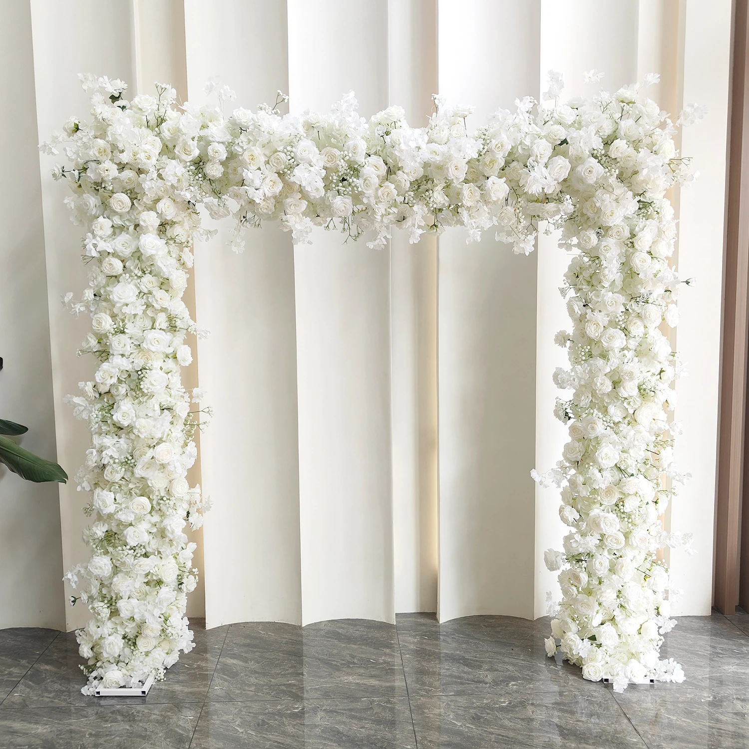 White Rose Hydrangea Wedding Flower Arch displayed for decorative use