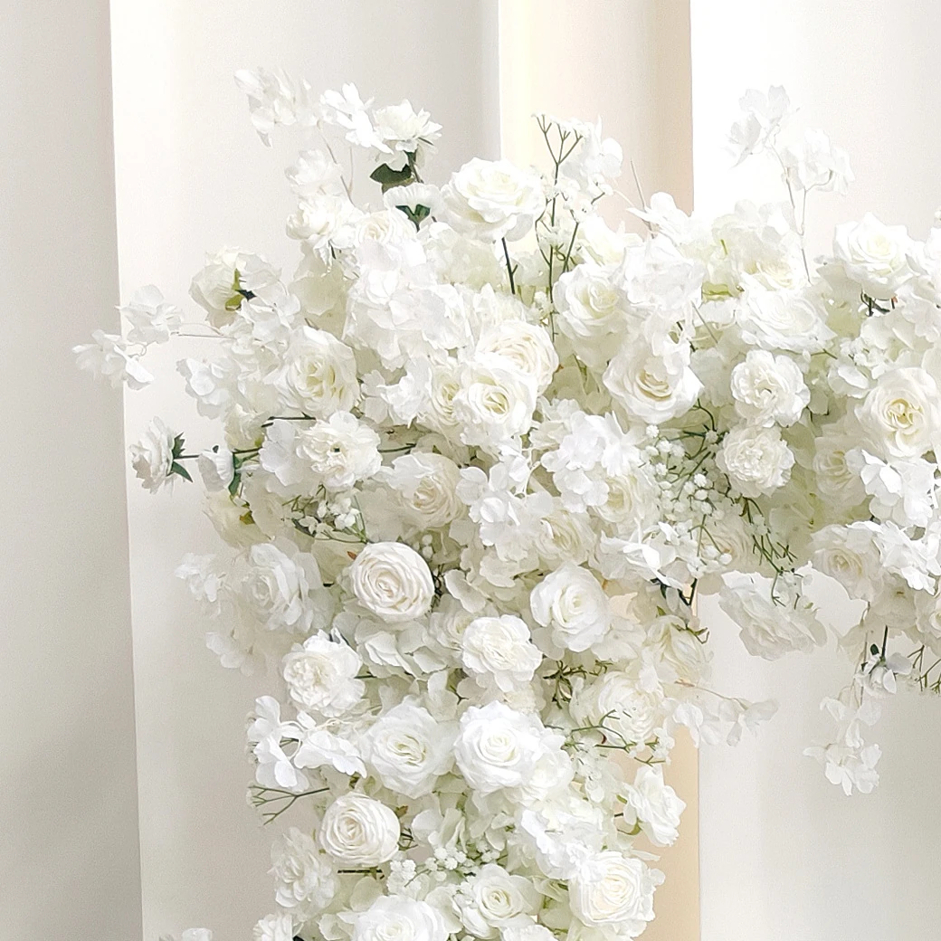 Close-up of white rose hydrangea wedding flower arch