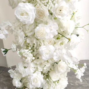 Close-up of white rose hydrangea wedding flower arch