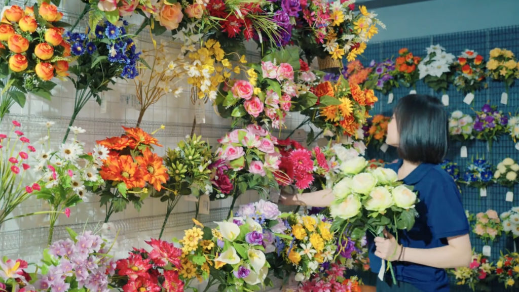 Different wholesale buyers sourcing artificial flowers from China factory for import and distribution